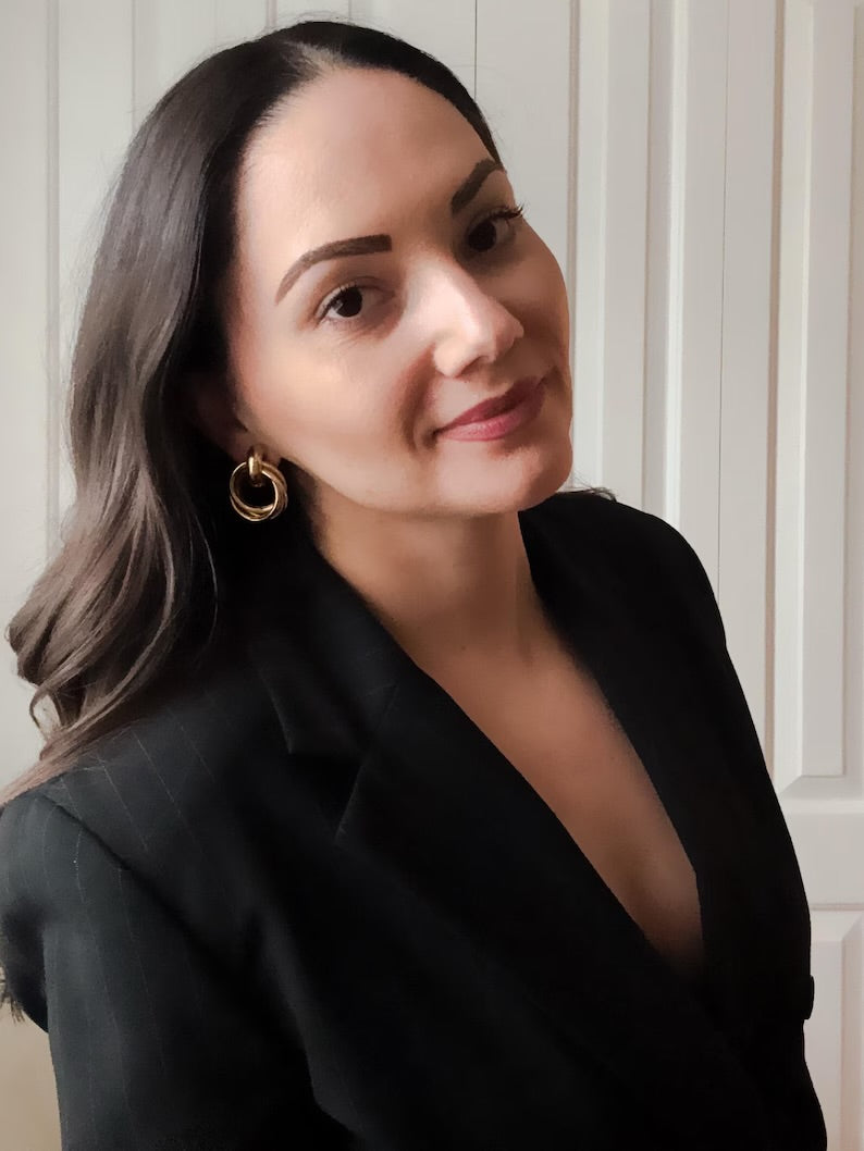 Vintage 90s gold statement earrings style with a tailored pinstripe blazer.