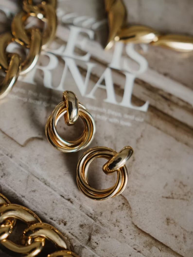 Gold-toned double-ring stud earrings
.