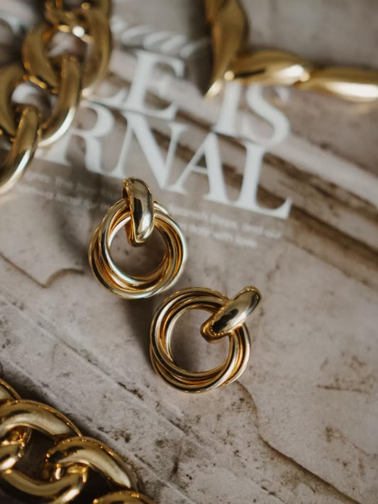 Gold-toned double-ring stud earrings
.